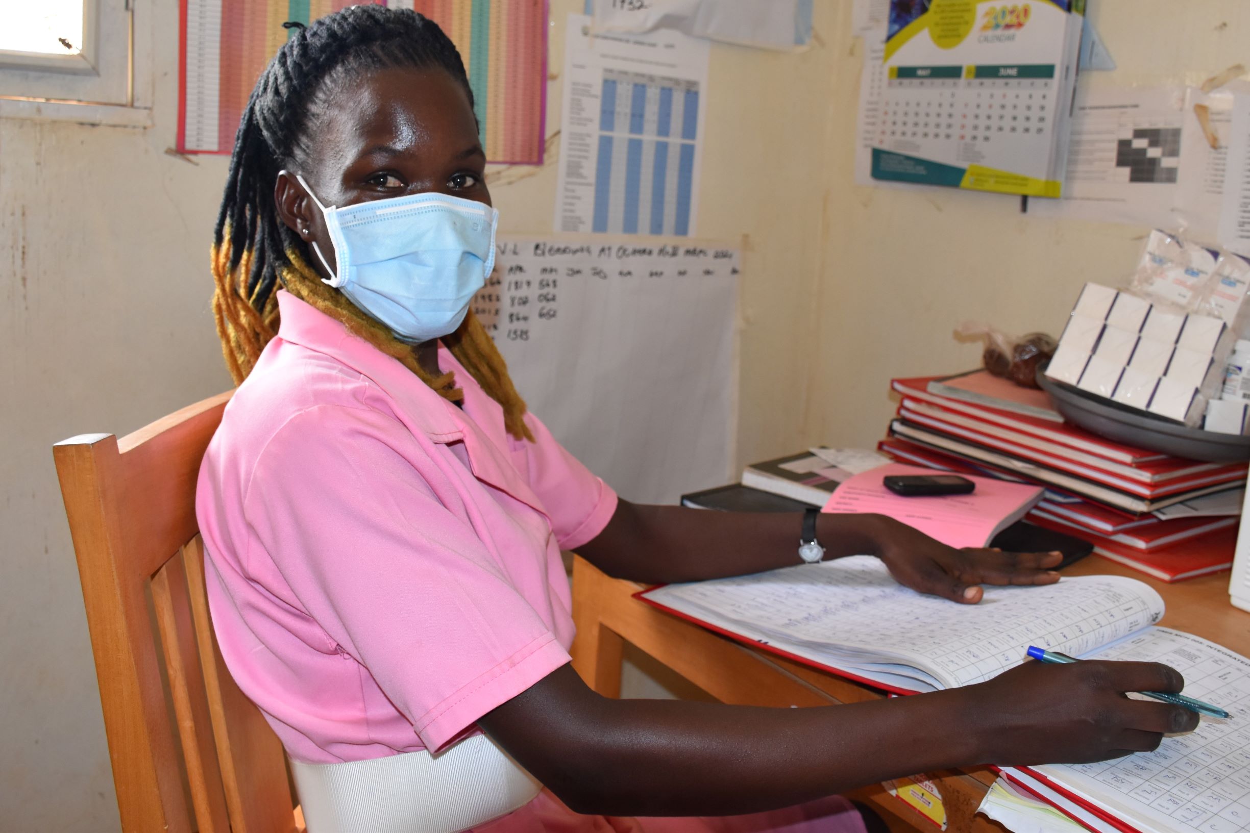 Catherine, a midwife at Ochero Health Center III, adapted quickly to continue providing high-quality maternal and child health services to mothers who come to the health center. Photo by Irene Mirembe for IntraHealth International.